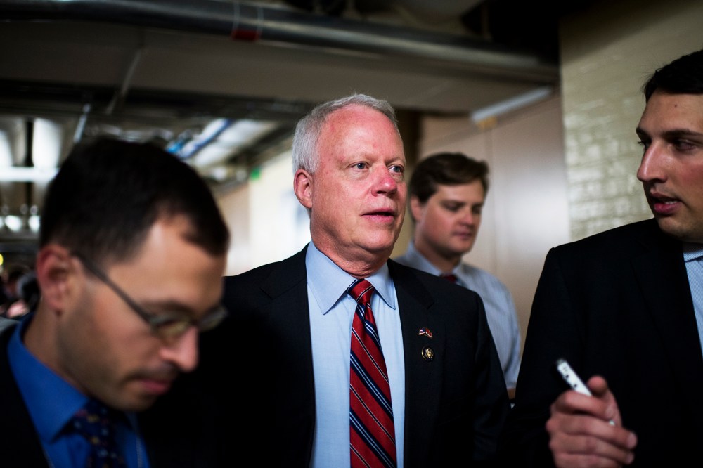 Rep. Paul Broun speaks with reporters as he leaves the House Republican Conference, Sept. 26, 2013.