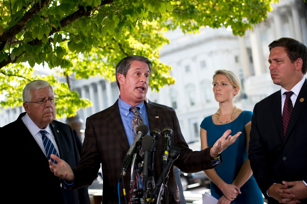 US Senator David Vitter (C) speaks during a press conference on Capitol Hill, September 30, 2013.
