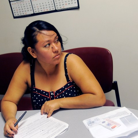 Rosa Ayala Cruz applies for health benefits at the Denver Health Westside Family Health Center on October 01, 2013 in Denver, Colorado.
