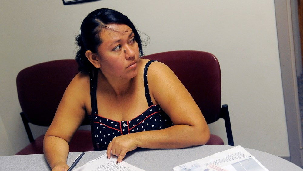 Rosa Ayala Cruz applies for health benefits at the Denver Health Westside Family Health Center on October 01, 2013 in Denver, Colorado.