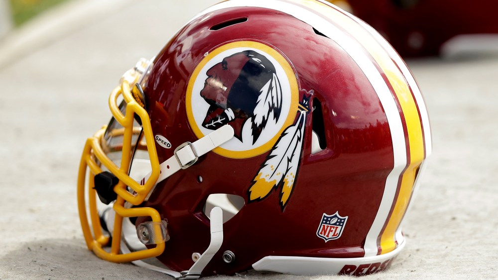 Washington Redskins helmets lay on the ground during their game against the Oakland Raiders at on September 29, 2013 in Oakland, Calif.