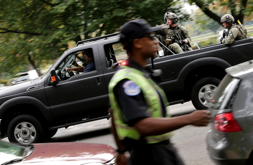 FBI agents in SWAT gear respond to an incident on Constitution Avenue outside the U.S. Capitol Oct. 3, 2013 in Washington.