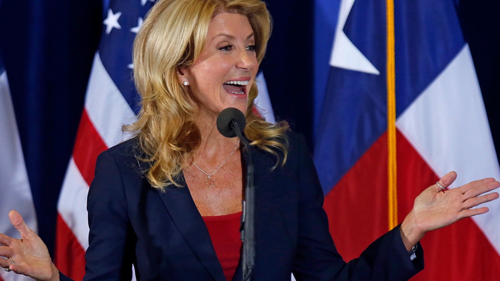 Texas State Sen. Wendy Davis speaks at the podium at the W.G. Thomas Coliseum in Haltom City on October 3, 2013 in Haltom City, Texas.