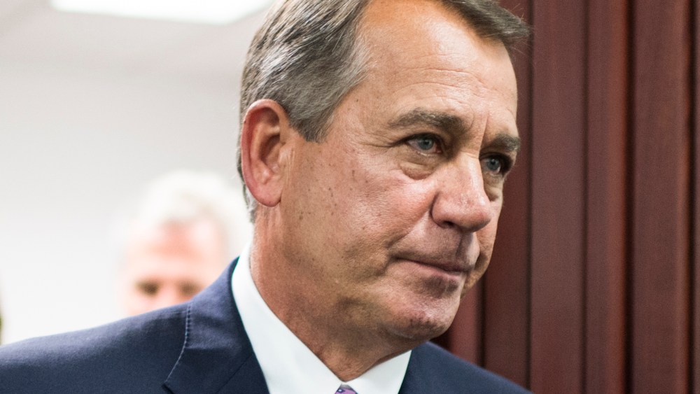 Speaker of the House John Boehner leaves the House Republican Conference meeting in the basement of the Capitol to speak to the media on Friday, Oct. 4, 2013.