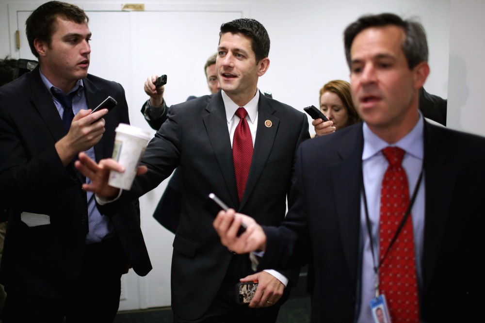 House Budget Committee Chairman Paul Ryan (R-WI) (C) heads for a House Republican caucus meeting at the U.S. Capitol on Oct. 4, 2013 in Washington, DC.