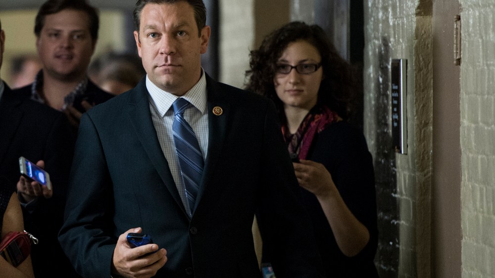 Rep. Trey Radel, R-Fla., speaks with reporters as he leaves the House Republican Conference meeting in the basement of the Capitol on Friday, Oct. 4, 2013.
