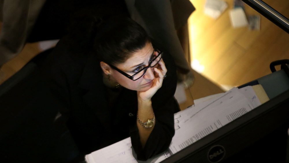 A trader works on the floor of the New York Stock Exchange on October 7, 2013 in New York City.