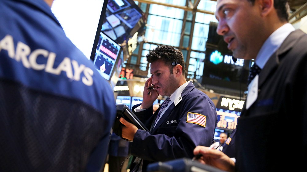 Traders work on the floor of the New York Stock Exchange on October 7, 2013 in New York City.