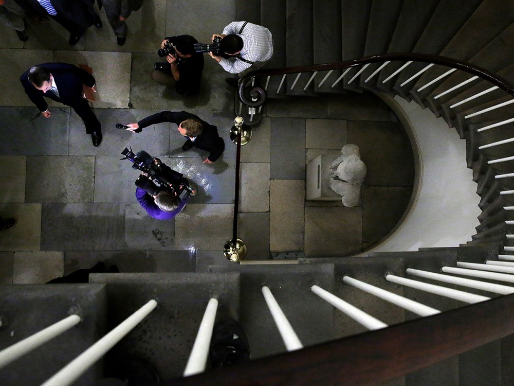 Reporters and photographers question Speaker of the House John Boehner (R-OH) as he arrives at the U.S. Capitol October 7, 2013 in Washington, DC.