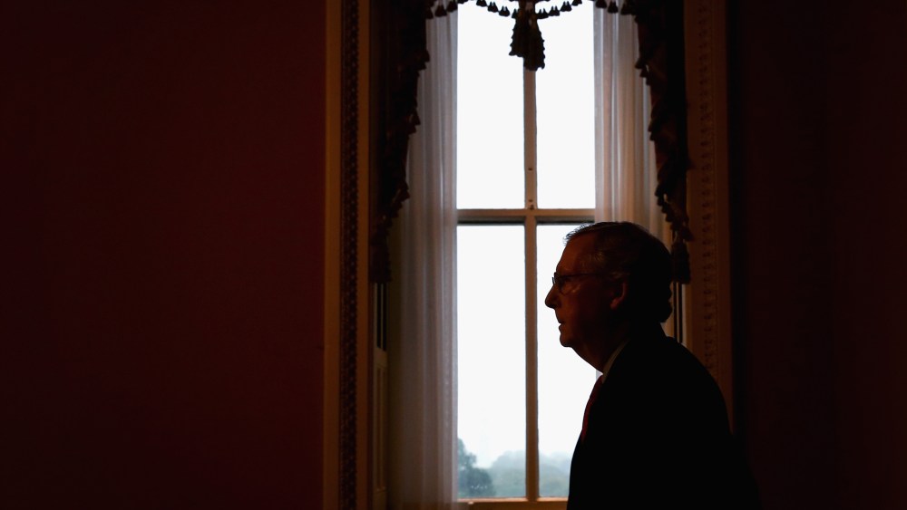 Senate Minority Leader Mitch McConnell (R-KY) returns to his office after speaking in the Senate Chamber, October 7, 2013.