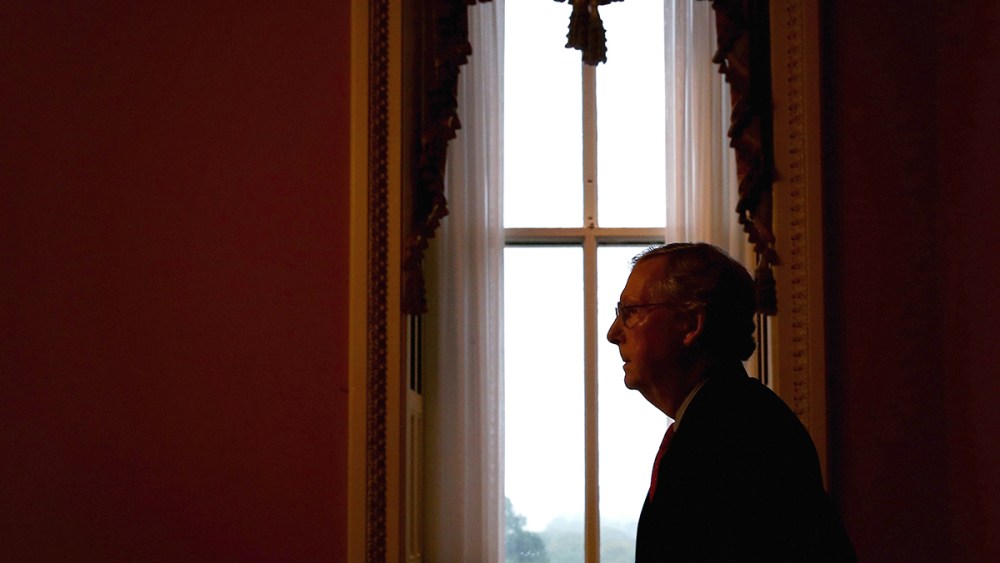 U.S. Minority Leader Senator Mitch McConnell (R-KY) returns to his office after he spoke in the Senate Chamber on Oct. 7, 2013