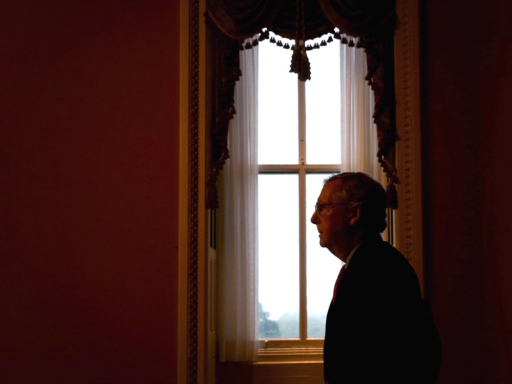 U.S. Minority Leader Senator Mitch McConnell (R-KY) returns to his office after he spoke in the Senate Chamber on Oct. 7, 2013