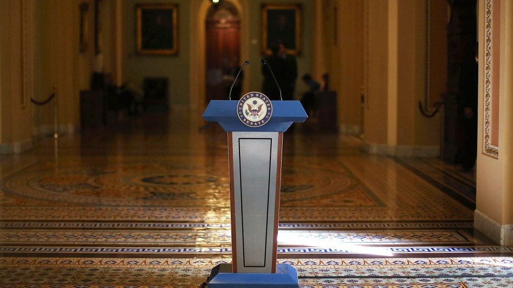 A podium stands where Senate Democrats and Republicans were scheduled to talk to the media after their policy luncheon meetings at the U.S. Capitol on Oct. 8, 2013 in Washington, DC.
