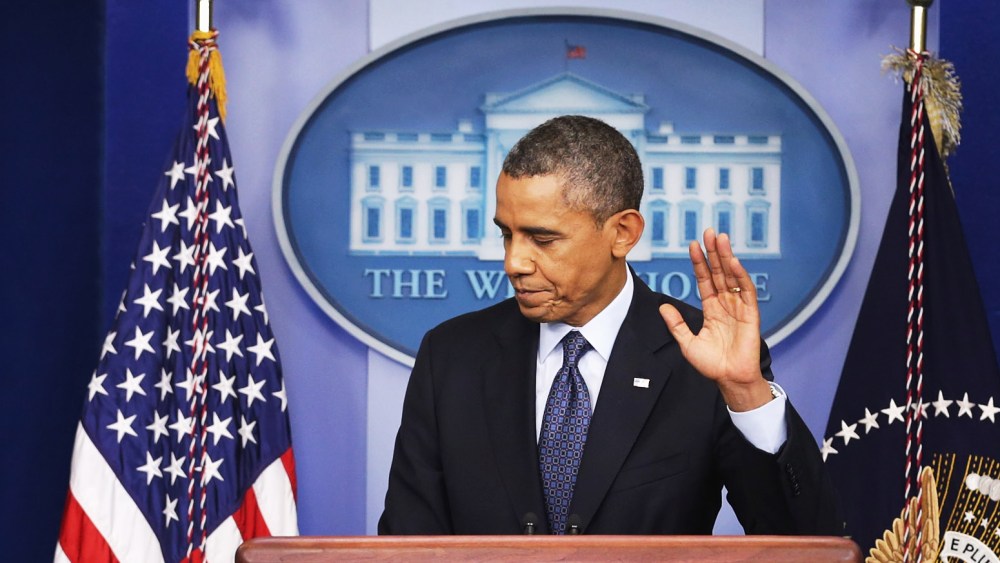 President Barack Obama waves at the conclusion of a press conference in the Brady Press Briefing Room of the White House on October 8, 2013 in Washington, DC.