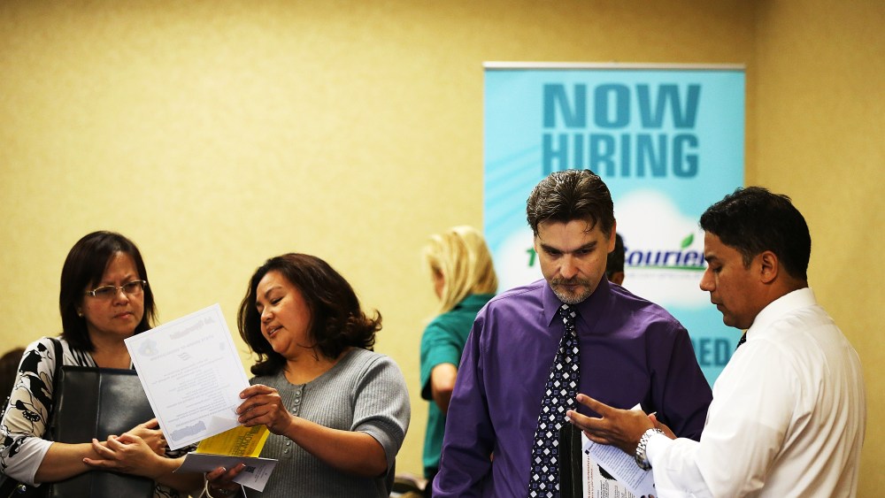 A job seeker meets with a recruiter during the East Bay's HIREvent on October 8, 2013 in Emeryville, California.