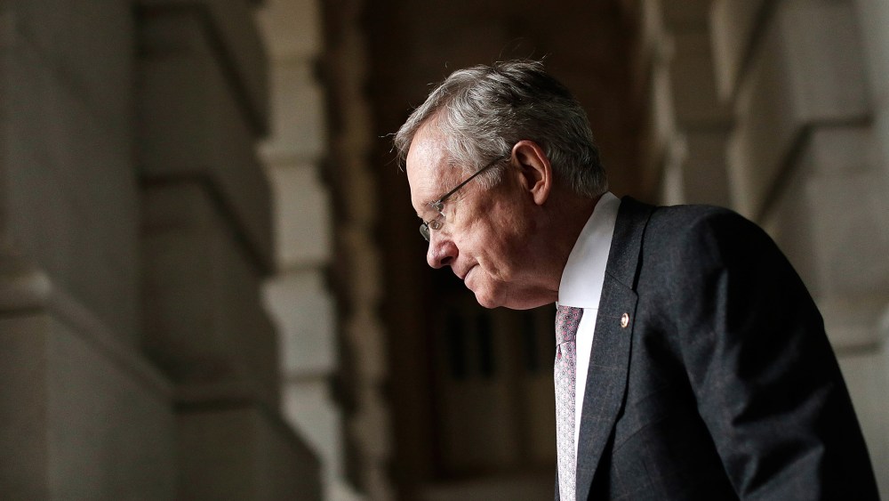 Senate Majority Leader Harry Reid (D-NV) walks to an event with Democratic senators on the steps U.S. Capitol October 9, 2013 in Washington, DC.