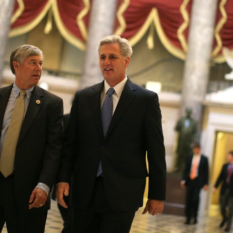 Majority Whip Kevin McCarthy (R-CA) (R) and Rep. Fred Upton R-MI) walk through Statuary Hall at the U.S. Capitol on Oct. 9, 2013 in Washington, DC.