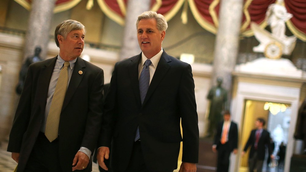Majority Whip Kevin McCarthy (R-CA) (R) and Rep. Fred Upton R-MI) walk through Statuary Hall at the U.S. Capitol on Oct. 9, 2013 in Washington, DC.