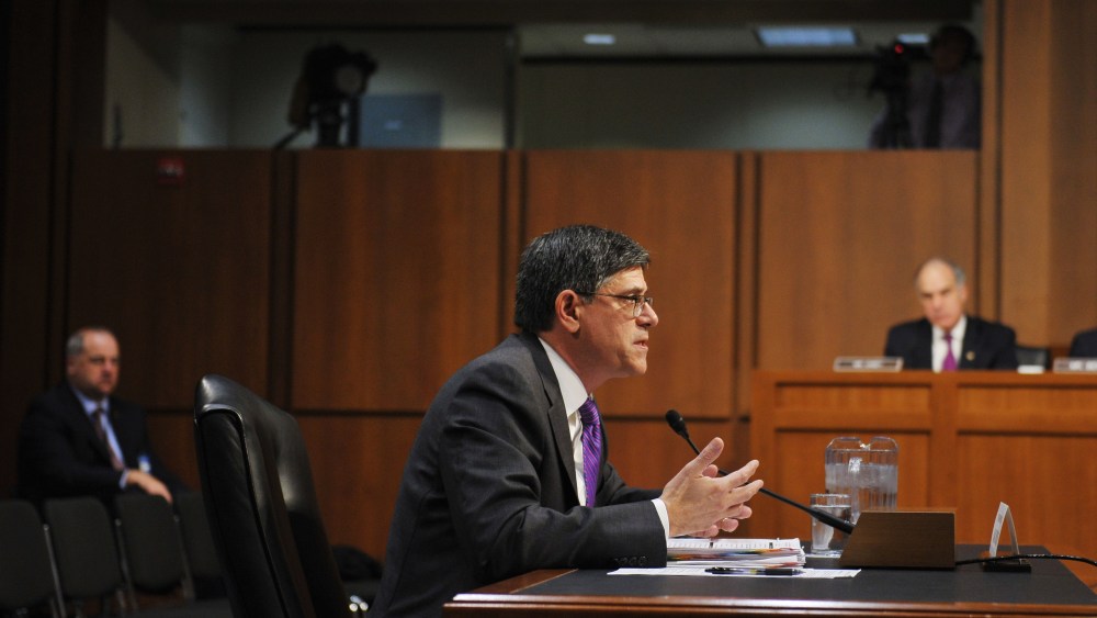 US Treasury Secretary Jack Lew (R) testifies before the US Senate Finance Committee about the debt limit on Oct. 10, 2013