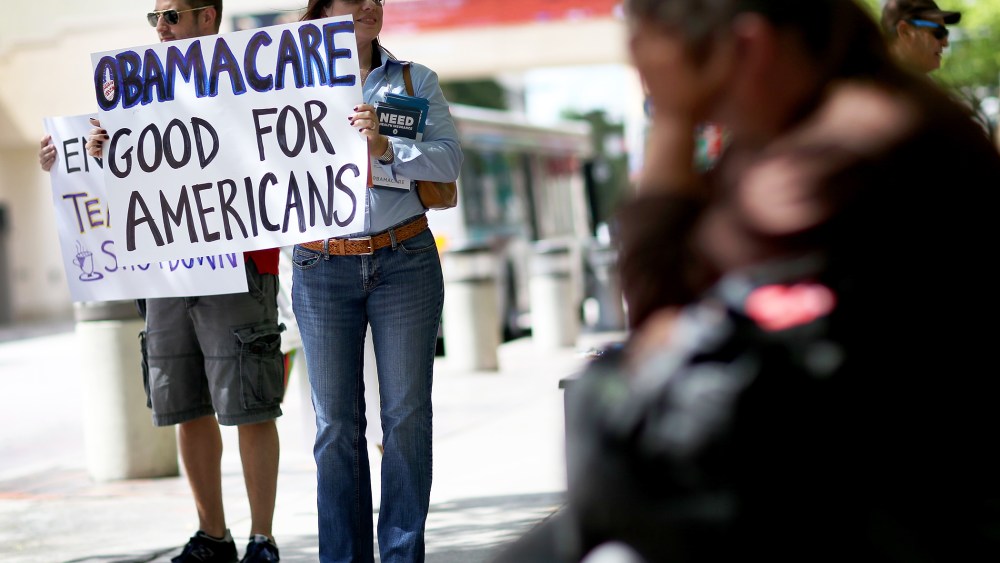 Haydee Perkal shows her support for the Affordable Care Act during a rally, October 10, 2013 in Miami, Florida.