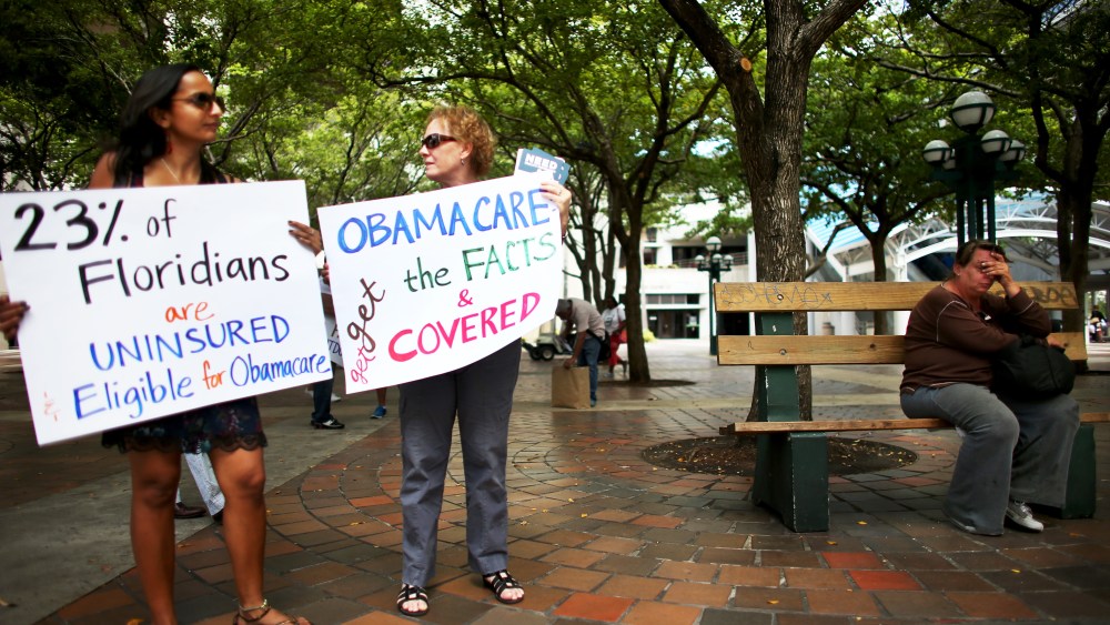 Supporters of the Affordable Care Act rally in Miami on October 10, 2013.
