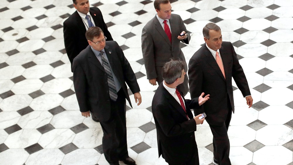 Speaker of the House John Boehner (R-OH) (R) walks from the House floor following a vote on Oct. 10, 2013 in Washington, DC.