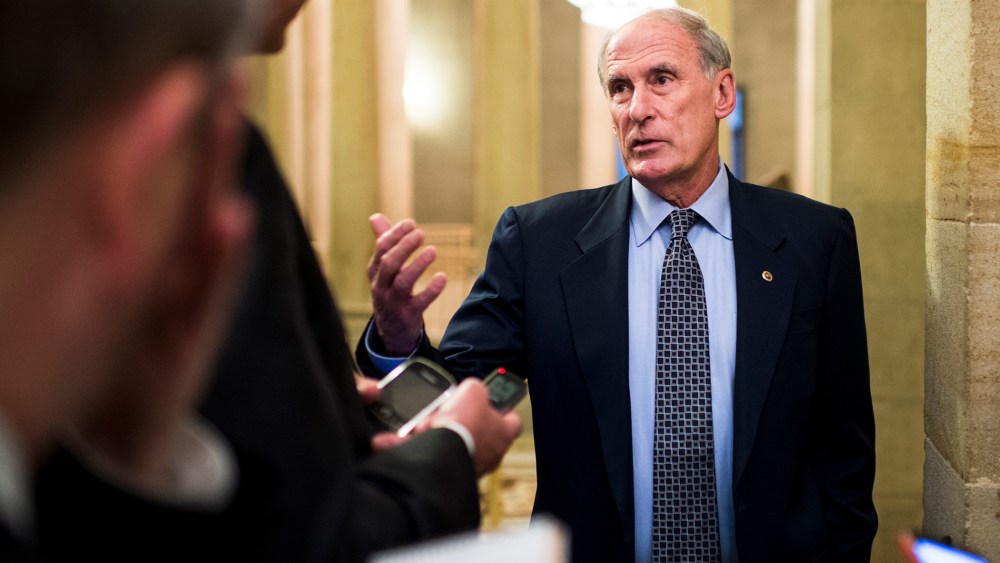 Sen. Dan Coats, R-Ind., speaks with reporters in the Capitol on, Oct. 10, 2013.