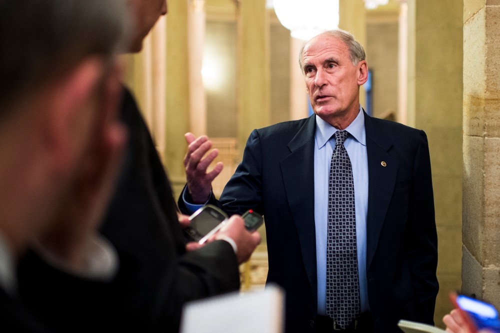 Sen. Dan Coats, R-Ind., speaks with reporters in the Capitol on, Oct. 10, 2013.