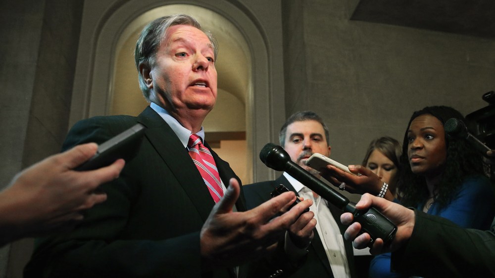 Sen. Lindsey Graham talks to reporters after leaving a Senate Republican caucus meeting at the U.S. Capitol October 11, 2013 in Washington, DC.