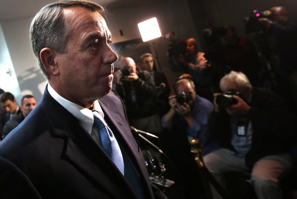 Speaker of the House Rep. John Boehner (R-OH) answers questions from the press followiong a meeting of House Republicans at the U.S. Capitol on Oct. 15, 2013 in Washington, DC.
