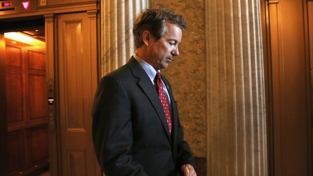 Sen. Rand Paul (R-KY) arrives at the Senate Republican Policy luncheon at the U.S. Capitol on Oct. 15, 2013 on Capitol Hill in Washington, DC.
