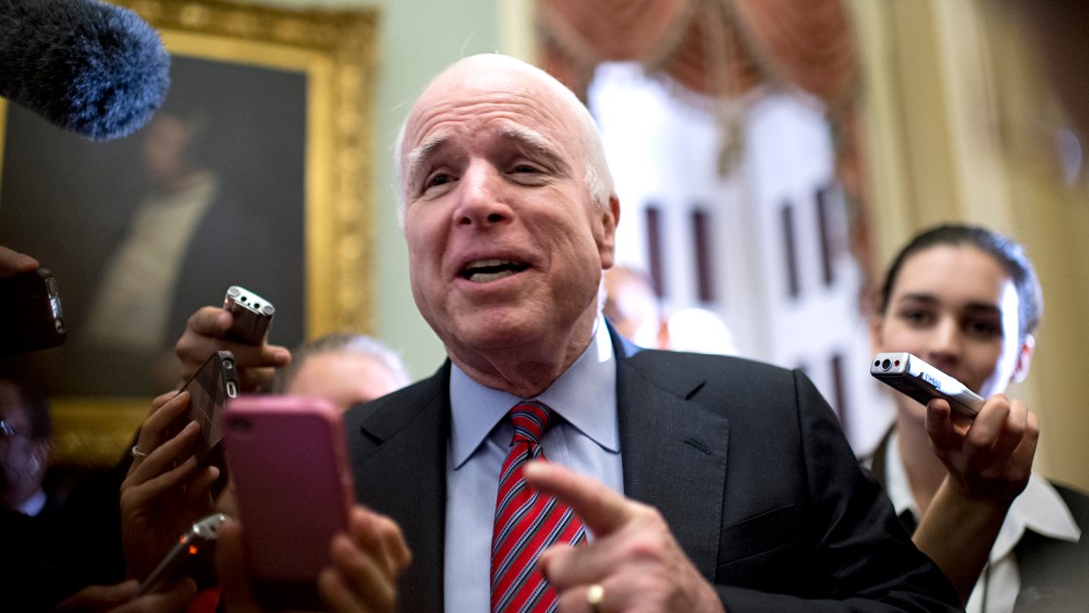 Sen. John McCain, R-Ariz., talks with reporters after a meeting of Senate republicans in the Capitol.