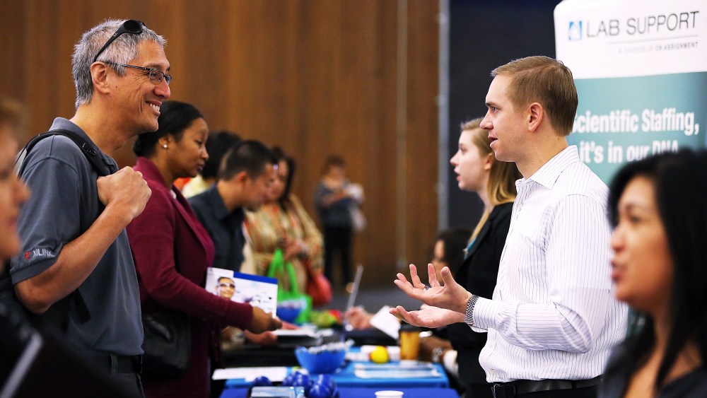 A job seeker meets with a recruiter during the Job Hunters Boot Camp in San Mateo, Calif. Oct. 16, 2013.
