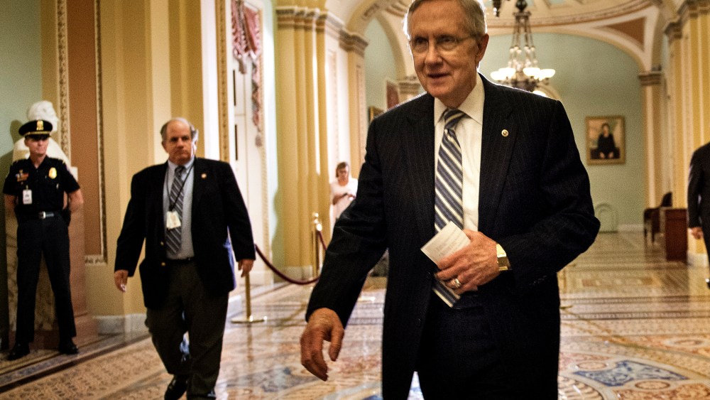 Senate Majority Leader Senator Harry Reid walks from the Senate floor after a vote on Capitol Hill October 16, 2013 in Washington, DC.