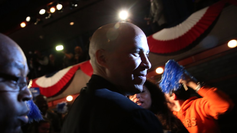Newly elected U.S. Senator Cory Booker walks on stage to speak after winning a special election on October 16, 2013 in Newark, New Jersey.