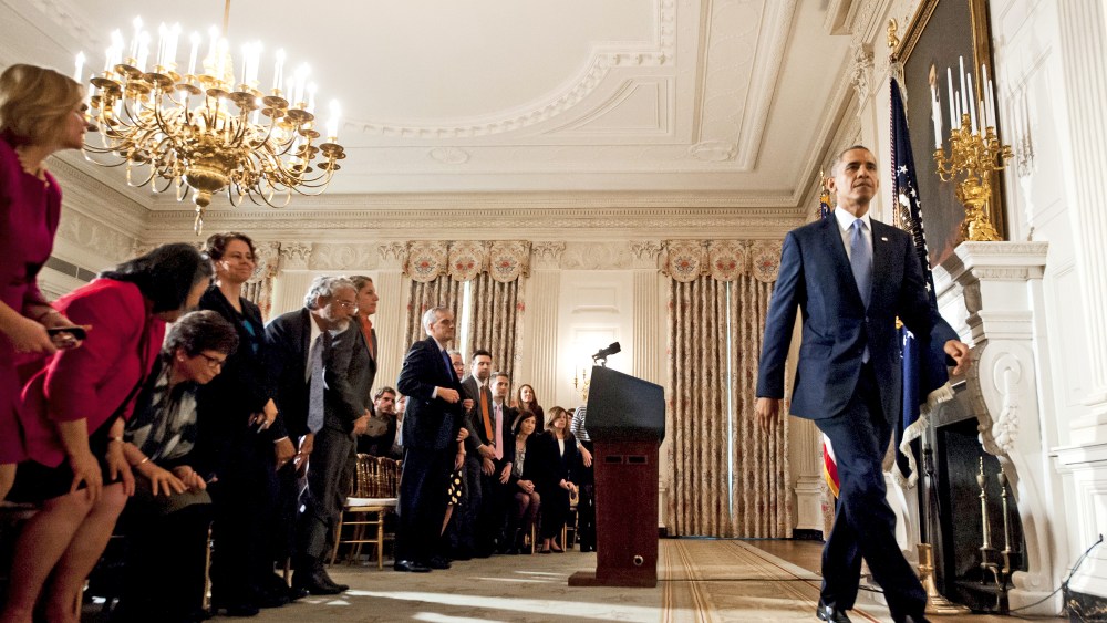 US President Barack Obama leaves after speaking about the reopening of government following a shutdown in the State Dining Room of the White House in Washington, DC, October 17, 2013.