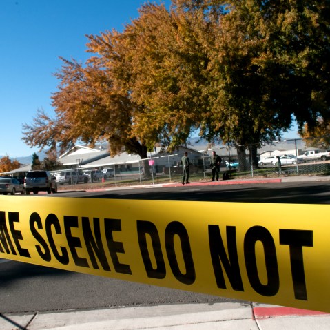 Police tape secures a crime scene on Oct. 21, 2013. (Photo by David Calvert/Getty)