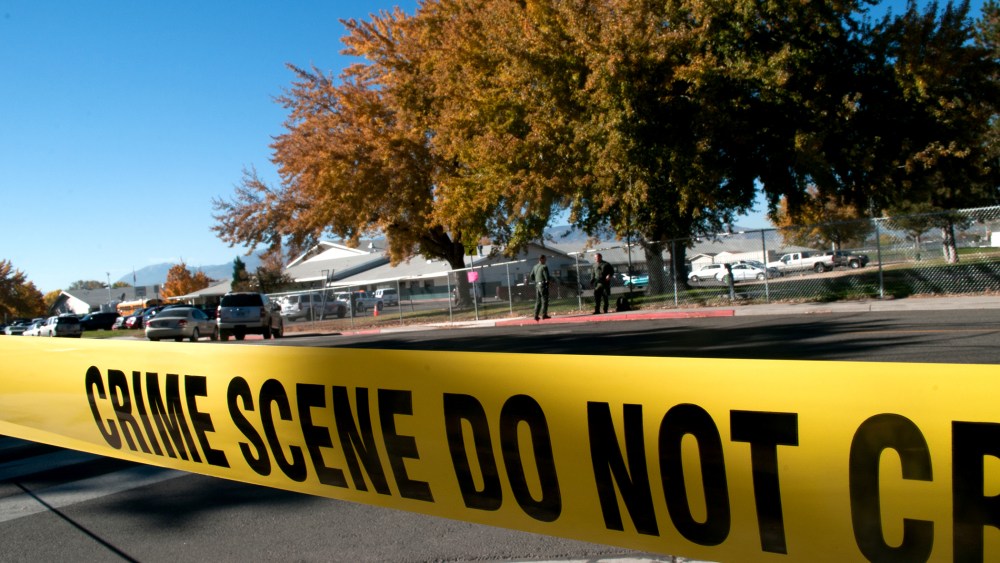 Police tape secures a crime scene on Oct. 21, 2013. (Photo by David Calvert/Getty)