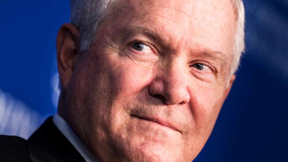 Former US Defense Secretary Robert Gates listens during a forum discussion at the Johns Hopkins University, Oct. 22, 2013.