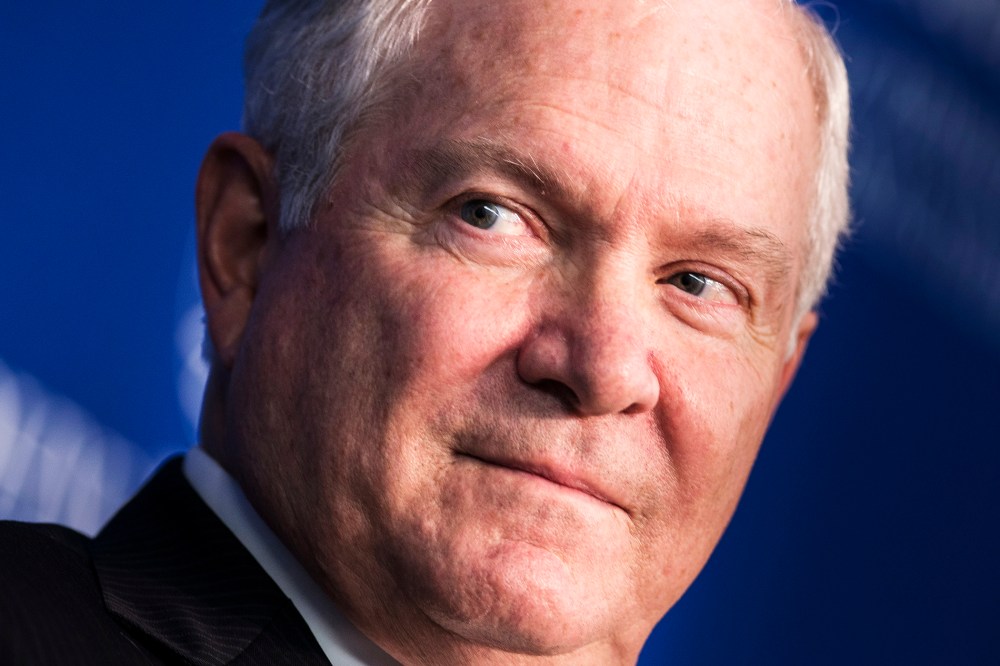 Former US Defense Secretary Robert Gates listens during a forum discussion at the Johns Hopkins University, Oct. 22, 2013.