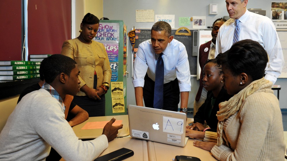 US President Barack Obama chats with students during a visit to a classroom at Pathways in Technology Early College High School, in Brooklyn, New York on October 25, 2013.