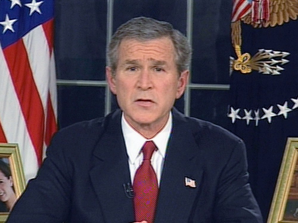 File Photo: (VIDEO CAPTURE) In this image from video, U.S. President George W. Bush announces that the U.S. military struck at "targets of opportunity" in Iraq March 19, 2003 in Washington, DC. Air defense sirens and anti-aircraft fire was reported...