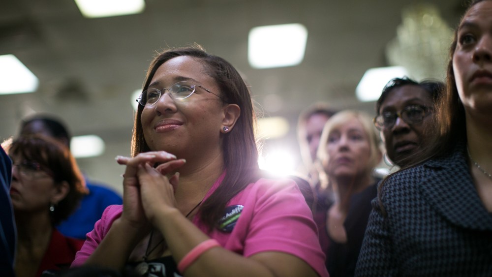 Supporters of Virginia Governor Terry McAuliffe listen during a campaign event in Dale City, Va., Oct. 27, 2013.