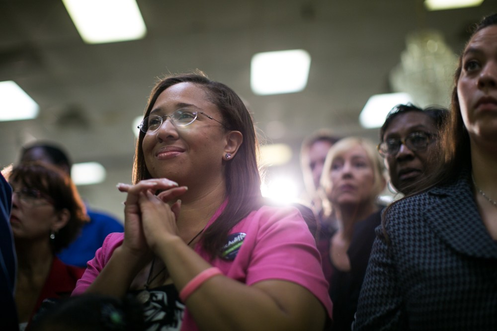 Supporters of Virginia Governor Terry McAuliffe listen during a campaign event in Dale City, Va., Oct. 27, 2013.