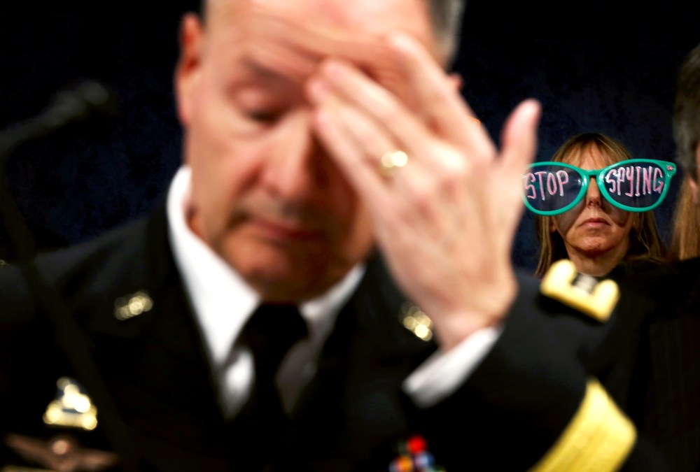 Keith Alexander waits for the beginning of a hearing before the House Intelligence Committee October 29, 2013 on Capitol Hill in Washington, DC.