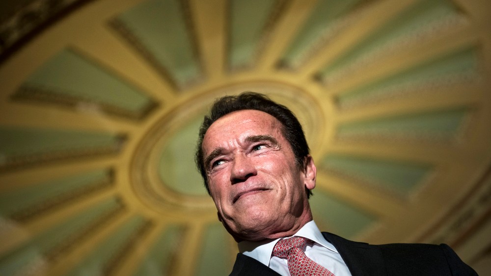 Actor and former California governor Arnold Schwarzenegger listens to questions from the press on Capitol Hill on Oct. 30, 2013 in Washington, D.C. (Photo by Brendan Smialowski/AFP/Getty)