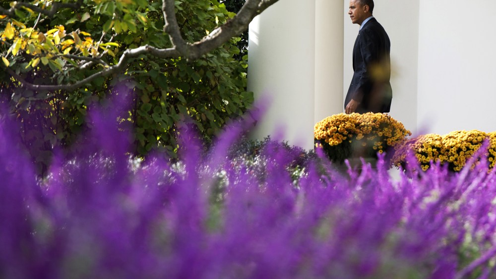 President Barack Obama walks out of the Oval Office adjacent to the Rose Garden prior to departing on Marine One from the South Lawn of the White House in Washington, D.C. on Nov. 5, 2013.