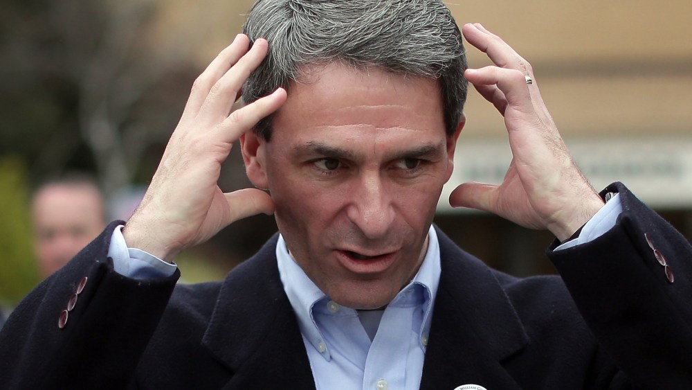 Ken Cuccinelli talks with supporters while greeting voters at Hanover Precinct 304 at Atlee High School on November 5, 2013 in Mechanicsville, Virginia.