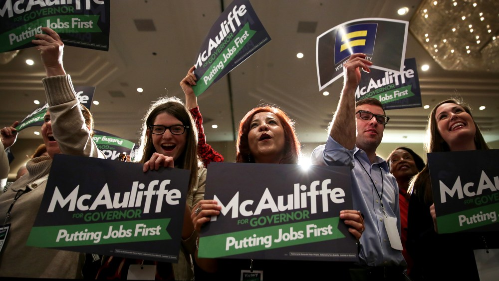 Supporters participate in the election night event of Democratic Virginia gubernatorial candidate Terry McAuliffe, November 5, 2013 in Tysons Corner, Virginia.