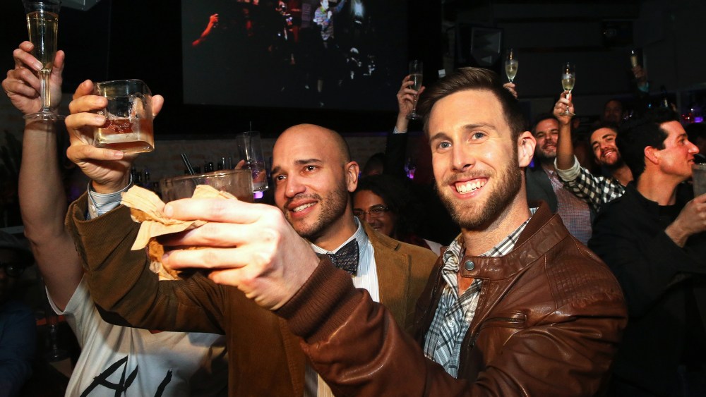 Fernando Mojica and  Drew Freeman raise a toast in celebration of the Illinois General Assembly's approval of a gay marriage bill on November 5, 2013 in Chicago, Illinois.
